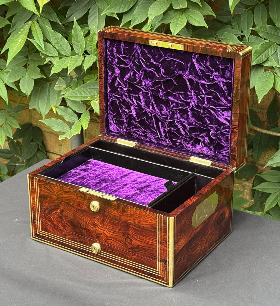 Front right internal view of an antique jewellery box in kingwood, by Halstaff & Hannaford.