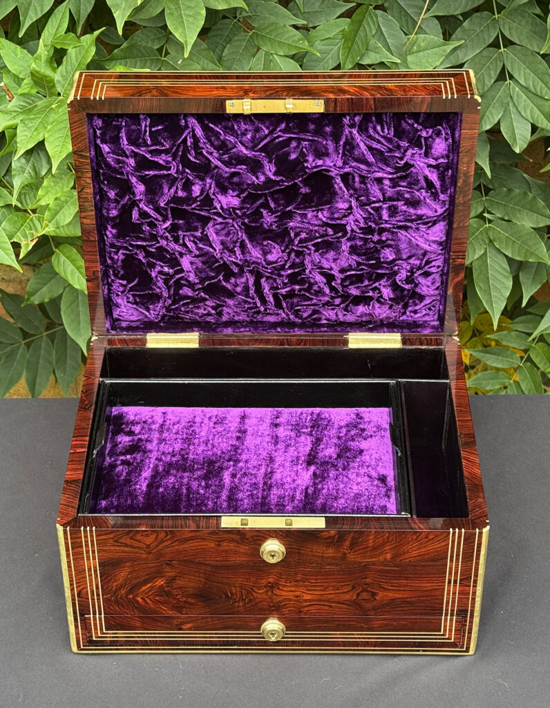 Front internal view of an antique jewellery box in kingwood, by Halstaff & Hannaford.
