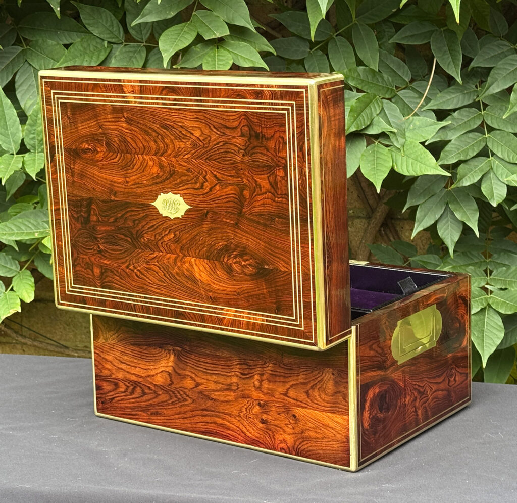 Rear opened view of an antique jewellery box in kingwood, by Halstaff & Hannaford.