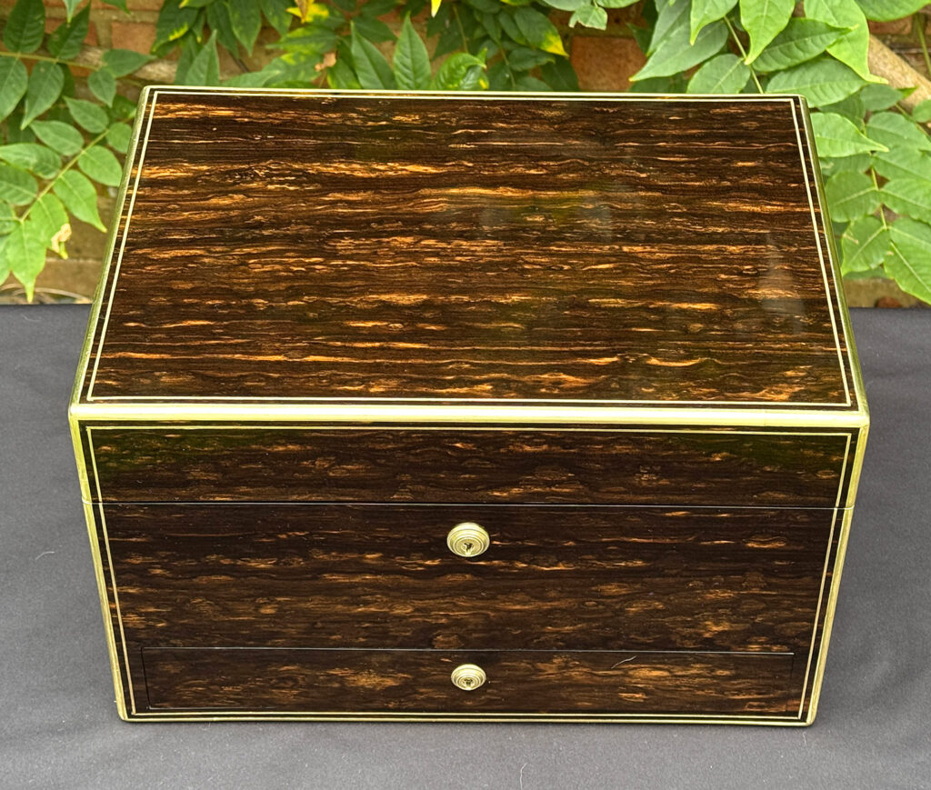 Overhead view of an antique jewellery box in coromandel, by Charles Asprey.