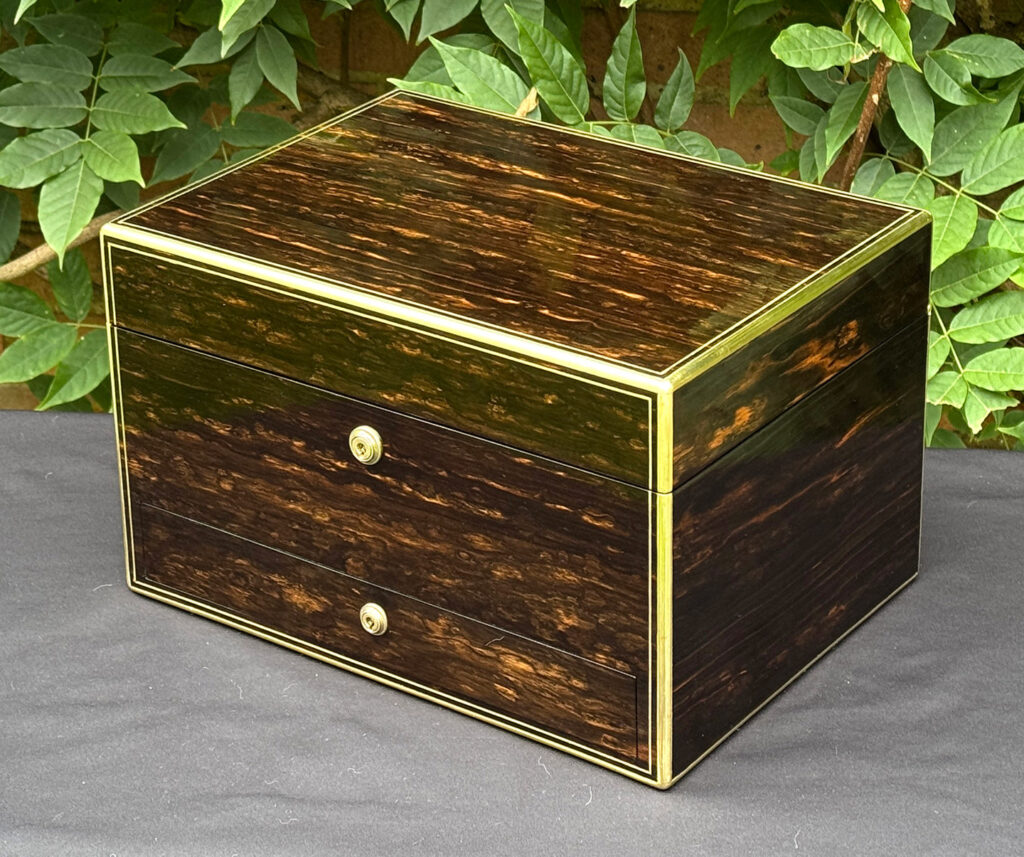 Front right view of an antique jewellery box in coromandel, by Charles Asprey.