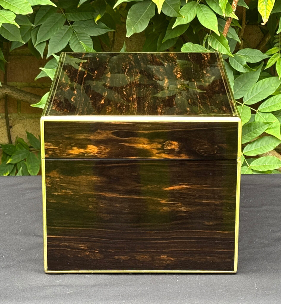 Right side view of an antique jewellery box in coromandel, by Charles Asprey.
