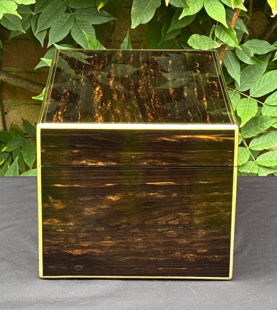Left side view of an antique jewellery box in coromandel, by Charles Asprey.