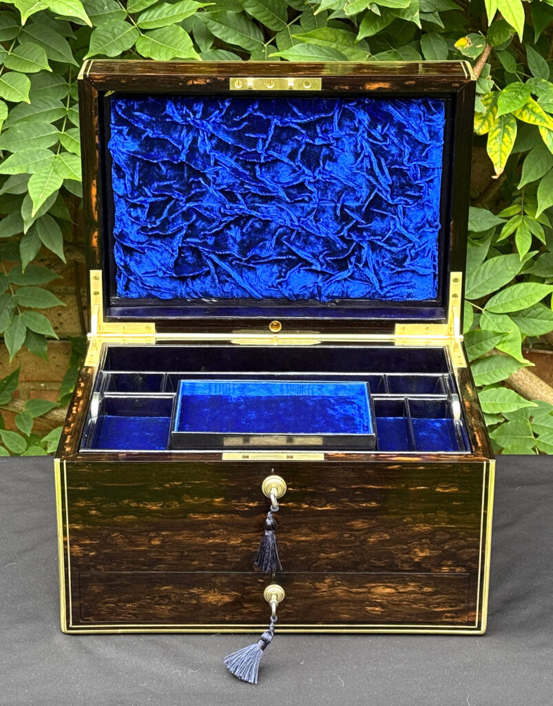 Front internal view of an antique jewellery box in coromandel, by Charles Asprey.