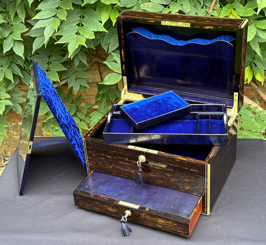 Front internal view of an antique jewellery box in coromandel, by Charles Asprey, with mirror removed.