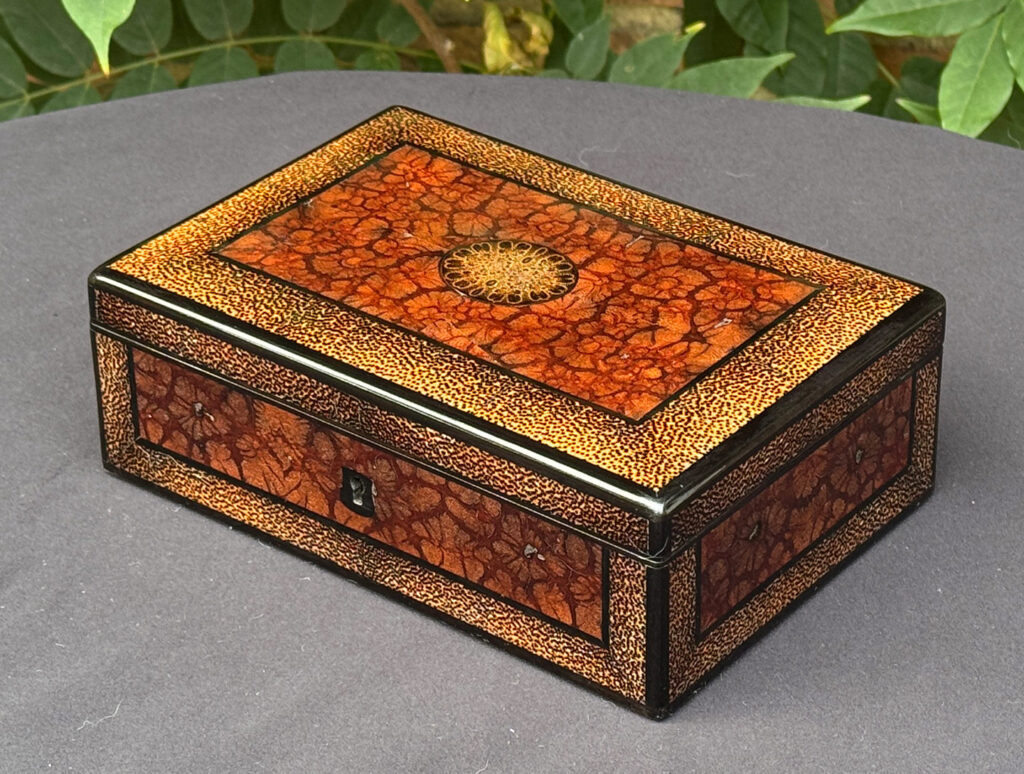 Front right view of a rare French miniature antique jewellery box in solid chrysanthemum and black palm wood.