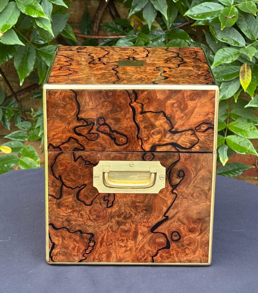 Right side view of an antique jewellery box in enhanced burr walnut.