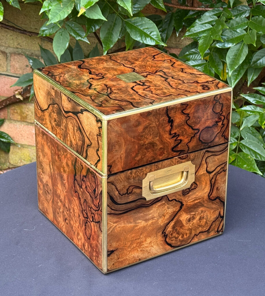 Rear left view of an antique jewellery box in enhanced burr walnut.