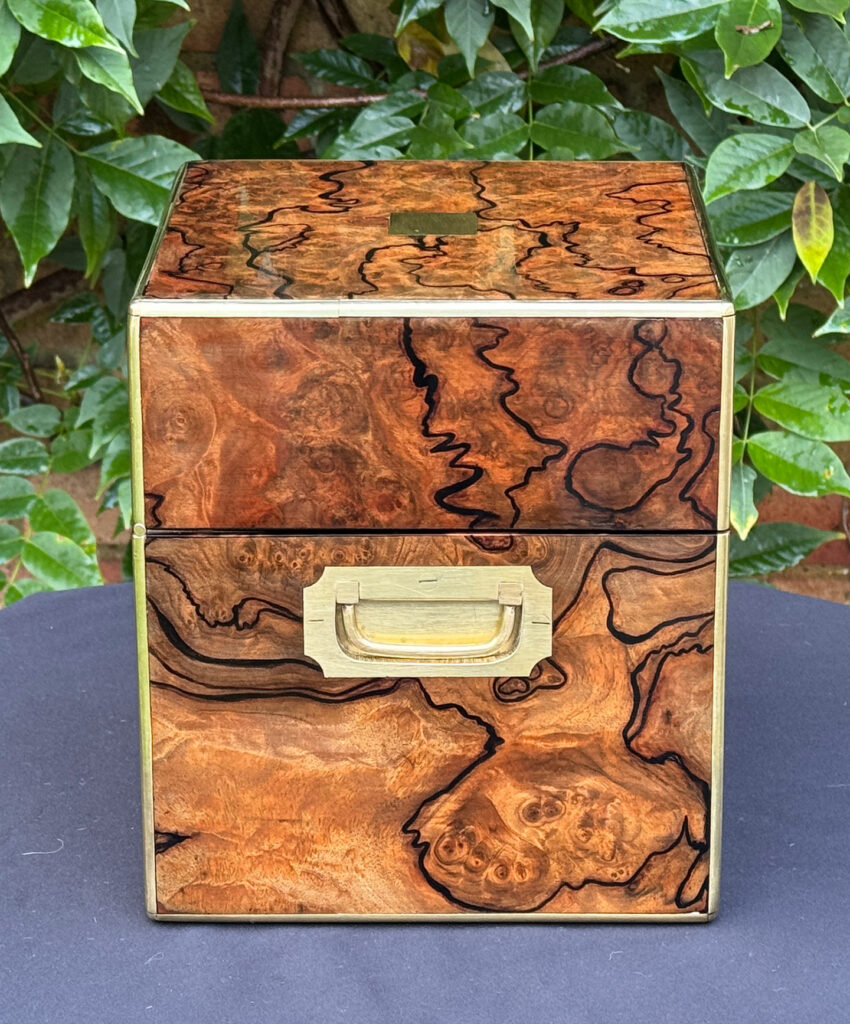 Left side view of an antique jewellery box in enhanced burr walnut.