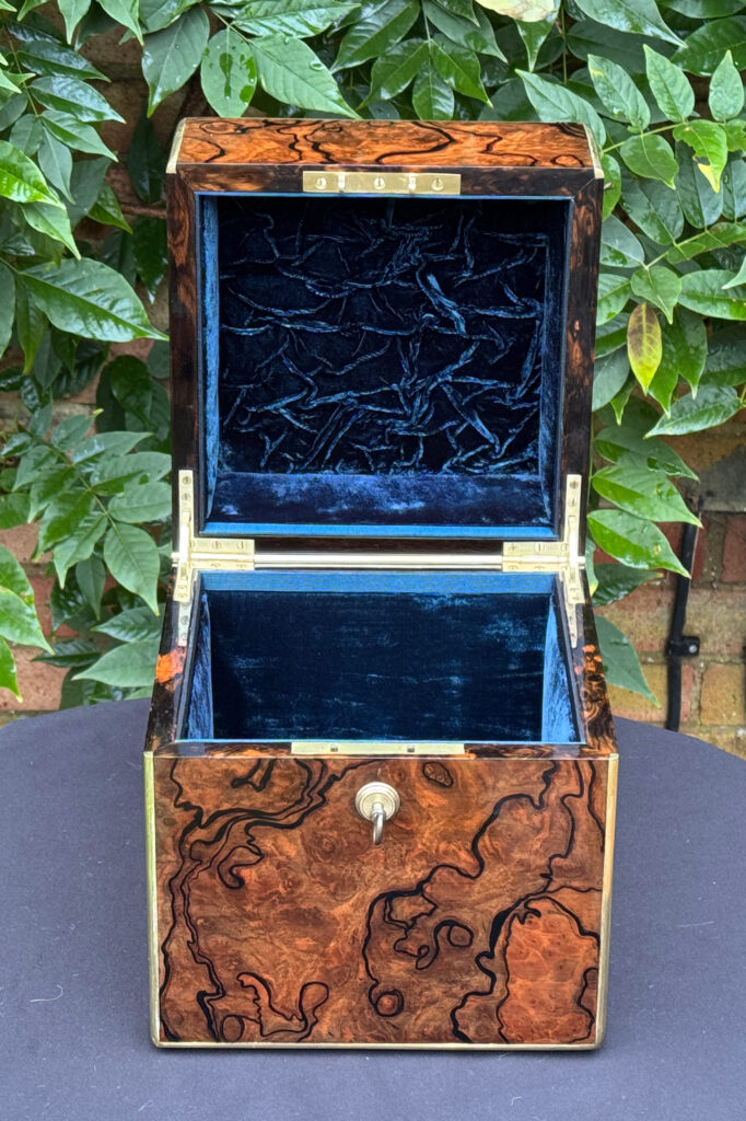 Front internal view of an antique jewellery box in enhanced burr walnut.