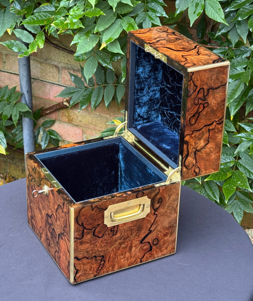 Right side internal view of an antique jewellery box in enhanced burr walnut.