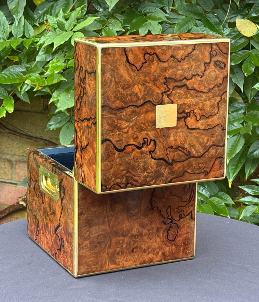 Rear opened view of an antique jewellery box in enhanced burr walnut.