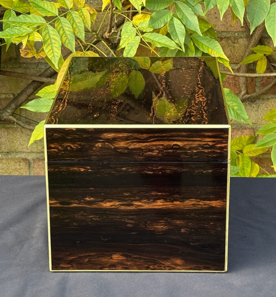 Right side view of an antique jewellery box in coromandel with two concealed drawers.