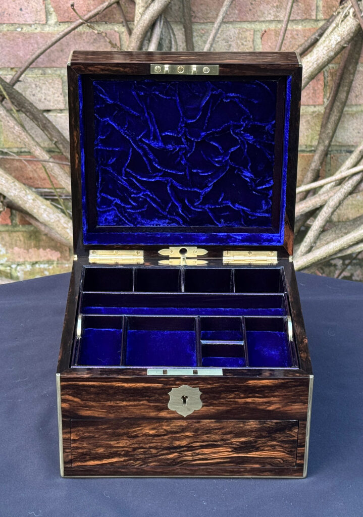 Front internal view of a miniature antique jewellery box in coromandel, by George Betjemann & Sons.