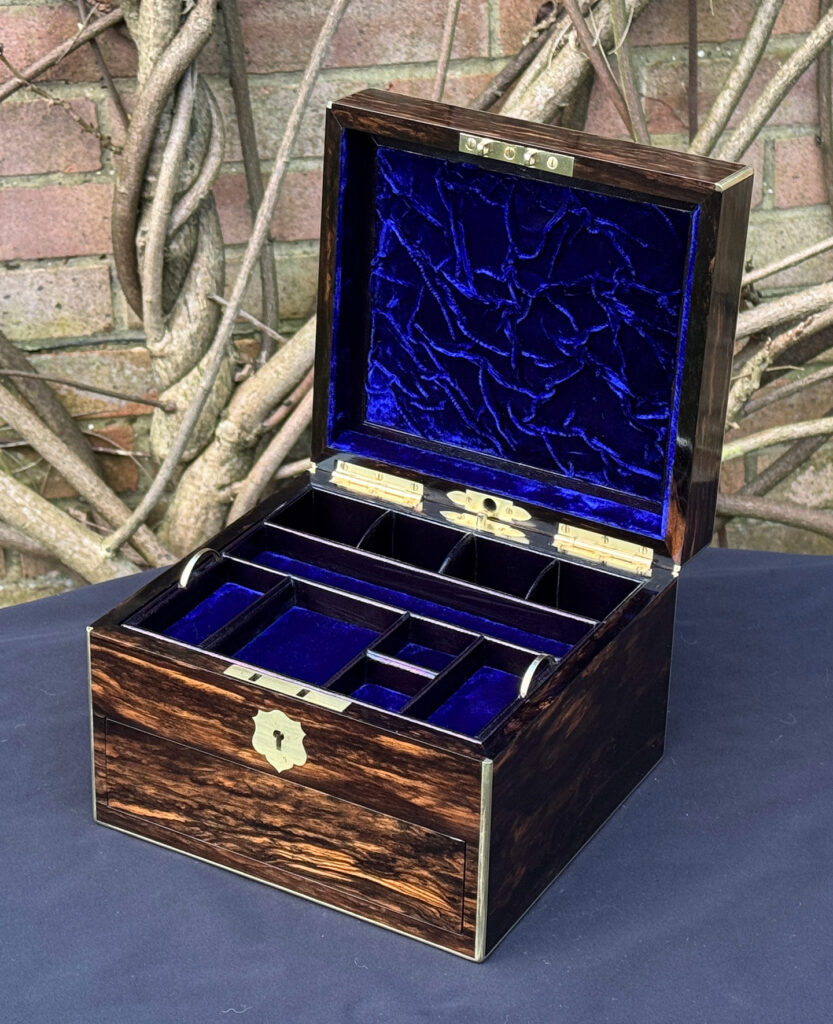 Front right internal view of a miniature antique jewellery box in coromandel, by George Betjemann & Sons.