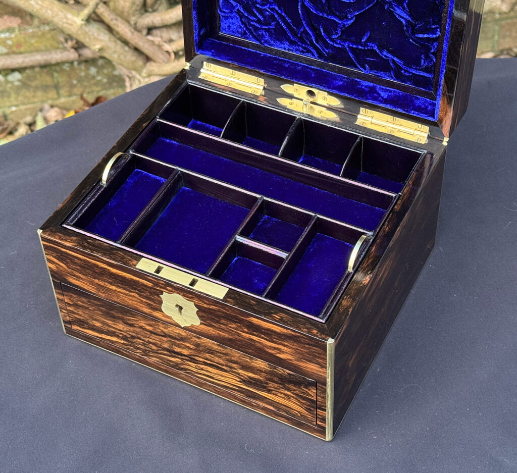 Closer internal view of a miniature antique jewellery box in coromandel, by George Betjemann & Sons.