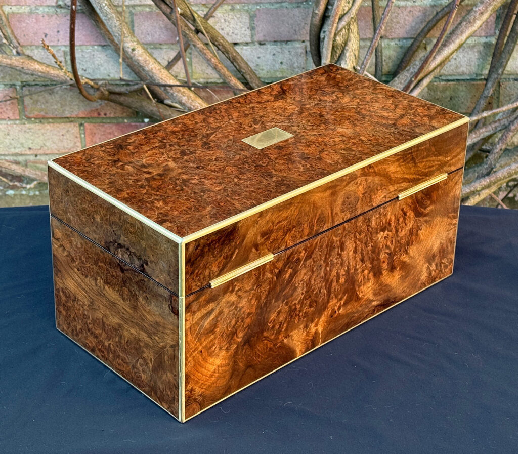 Rear right view of a large antique jewellery box in burr walnut.