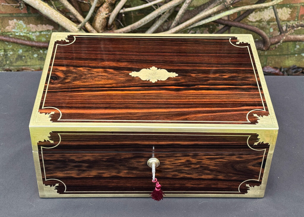 Overhead view of an antique jewellery box in calamander, by George Lawrence.