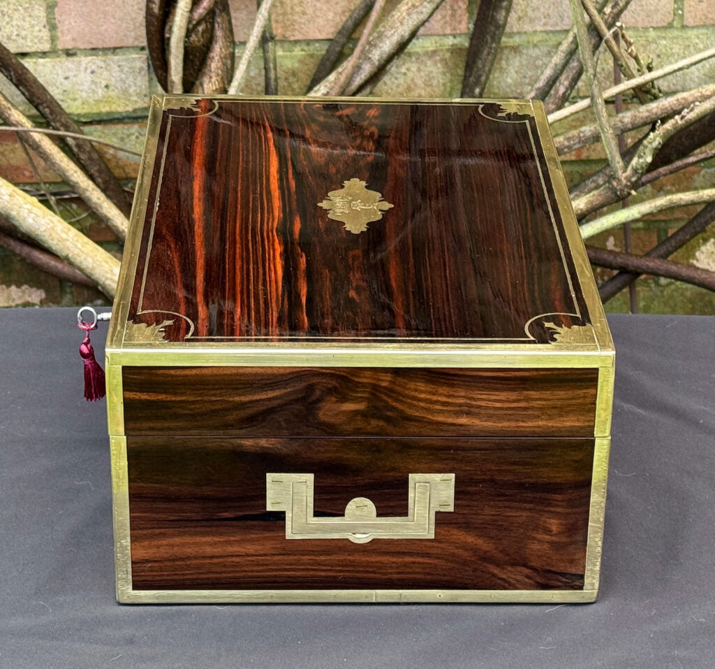 Right side view of an antique jewellery box in calamander, by George Lawrence.