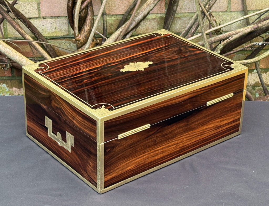 Rear right view of an antique jewellery box in calamander, by George Lawrence.
