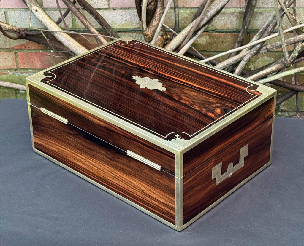Rear left view of an antique jewellery box in calamander, by George Lawrence.