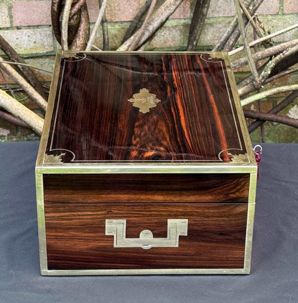Left side view of an antique jewellery box in calamander, by George Lawrence.