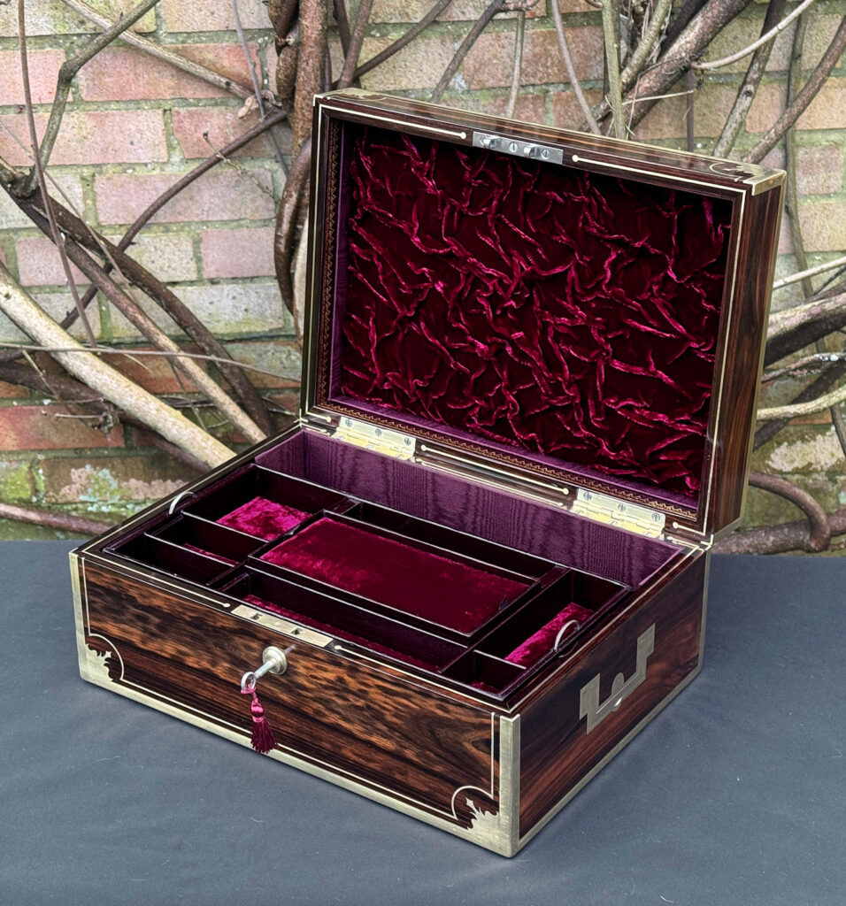 Front right interior view of an antique jewellery box in calamander, by George Lawrence.
