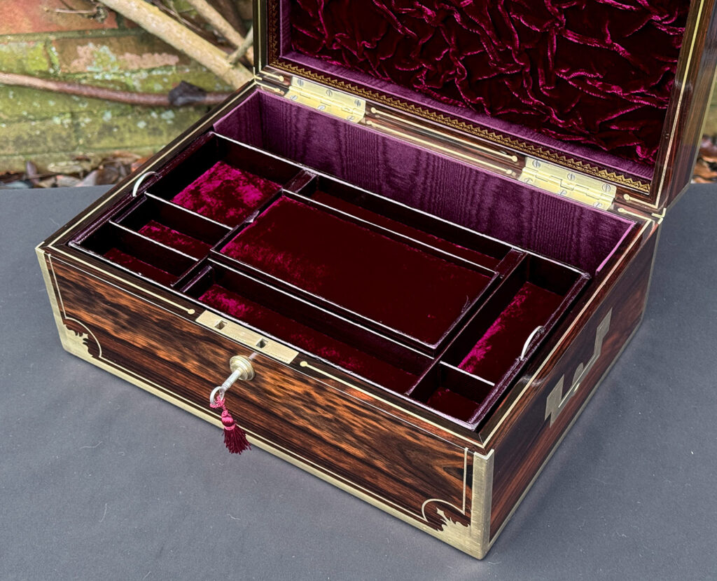 Closer interior view of an antique jewellery box in calamander, by George Lawrence.
