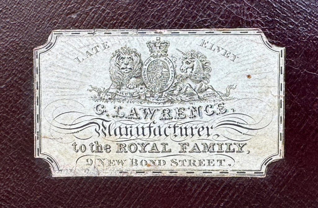 Paper manufacturers label from an antique jewellery box in calamander, by George Lawrence.
