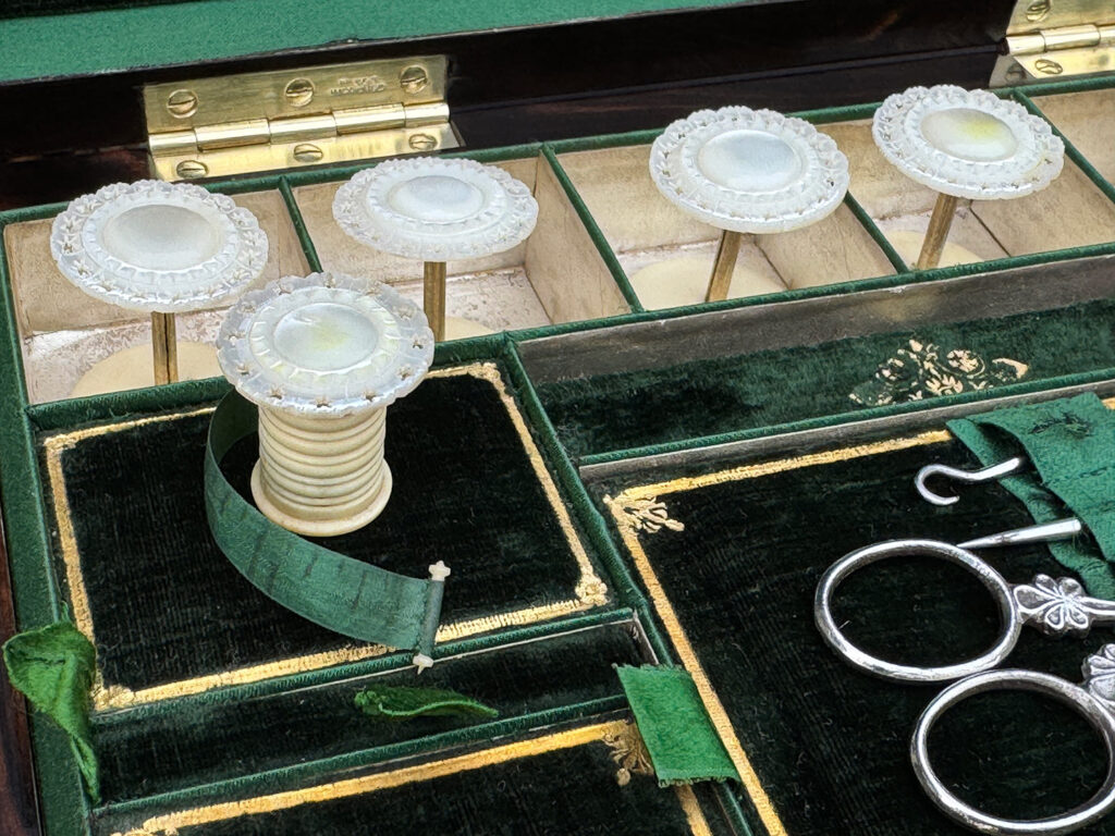 Close up view of the mother of pearl tape measure.