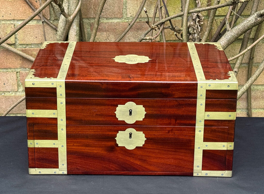 Front view of a large antique gentleman’s travelling jewellery box in Cuban mahogany, by Bayley & Blew.
