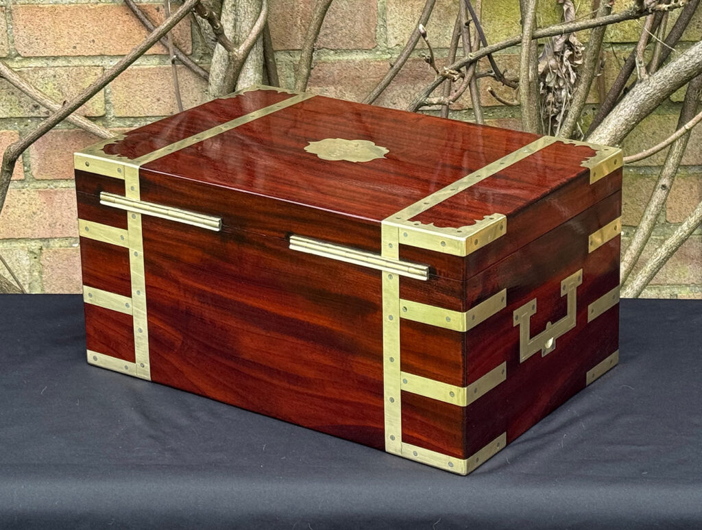 Rear left view of a large antique gentleman’s travelling jewellery box in Cuban mahogany, by Bayley & Blew.