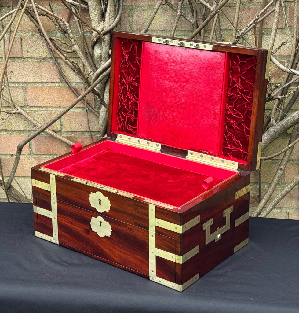Front right interior view of a large antique gentleman’s travelling jewellery box in Cuban mahogany, by Bayley & Blew.