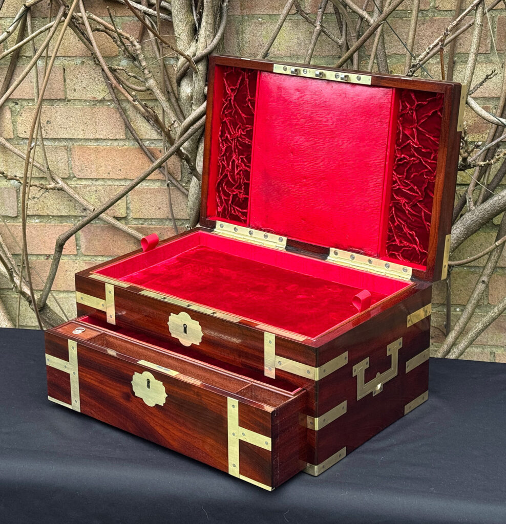 Front right interior view of a large antique gentleman’s travelling jewellery box in Cuban mahogany, by Bayley & Blew, with lower drawer open.