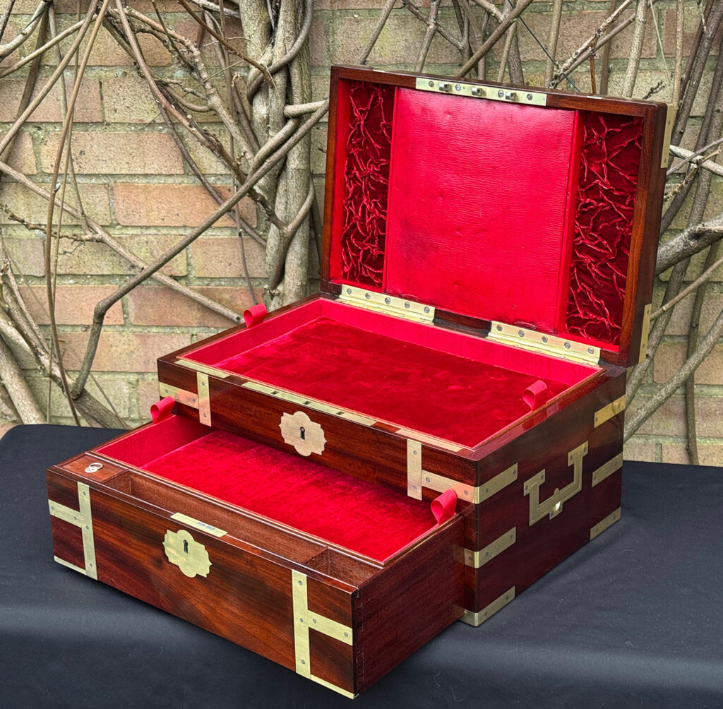 Front right interior view of a large antique gentleman’s travelling jewellery box in Cuban mahogany, by Bayley & Blew, with lower drawer open further.