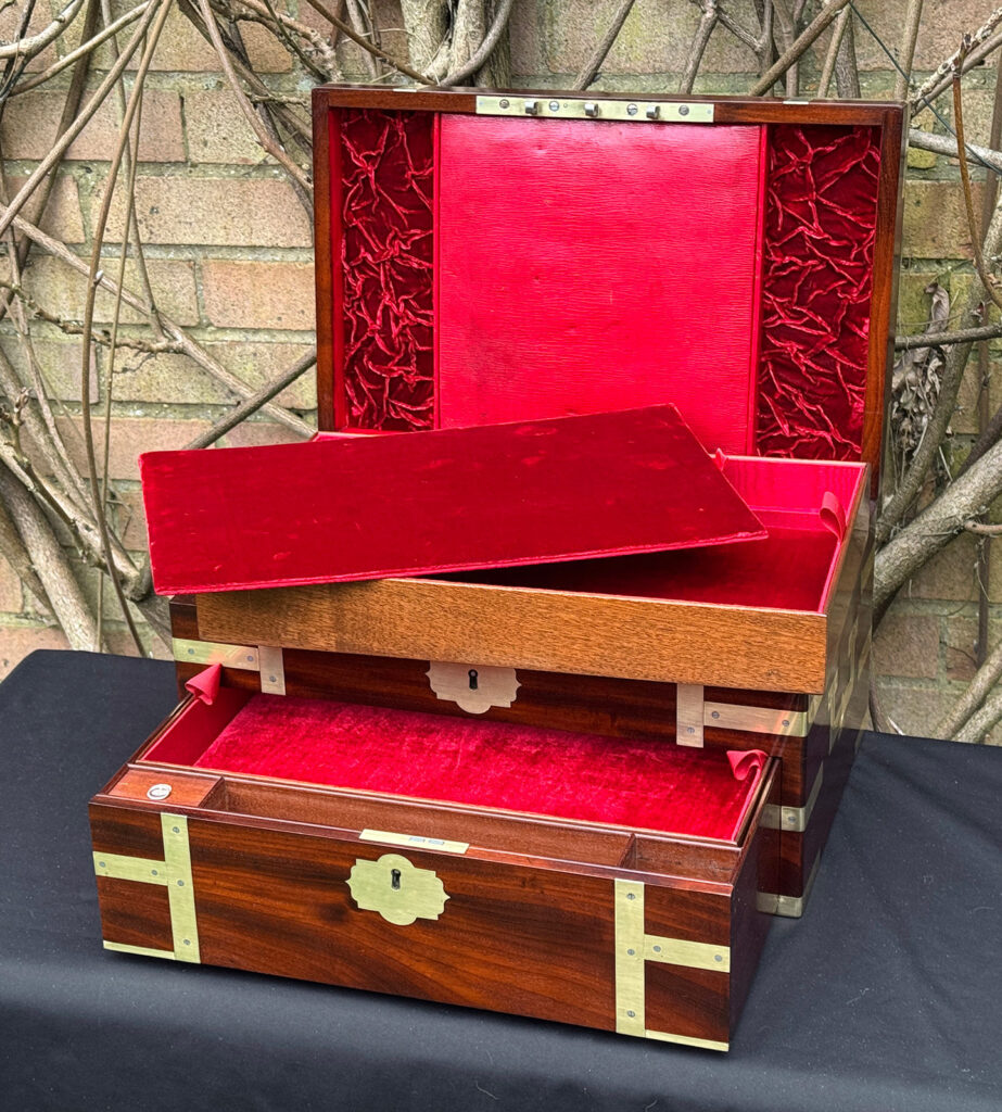Front right interior view of a large antique gentleman’s travelling jewellery box in Cuban mahogany, by Bayley & Blew, with secret floor removed from the top tray.