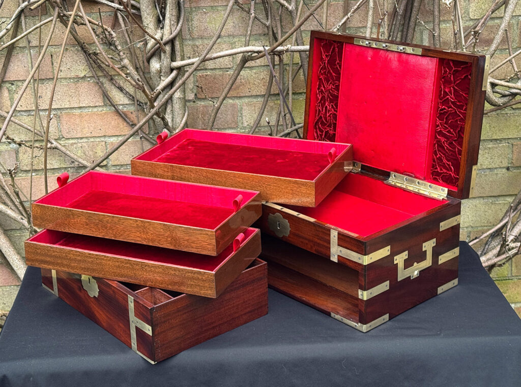 Interior view of a large antique gentleman’s travelling jewellery box in Cuban mahogany, by Bayley & Blew, with all trays removed.
