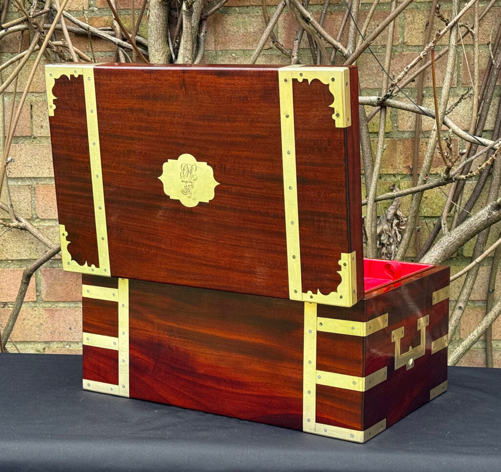 Rear opened view of a large antique gentleman’s travelling jewellery box in Cuban mahogany, by Bayley & Blew.