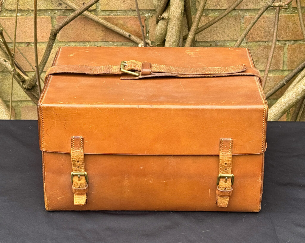 Front view of the outer leather case from an antique jewellery box in kingwood, by Wells & Lambe.