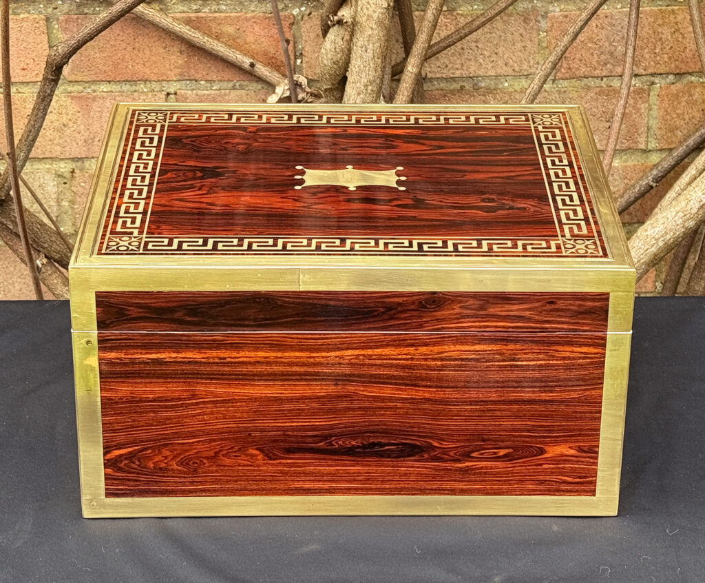 Rear view of an antique jewellery box in kingwood, by Wells & Lambe.