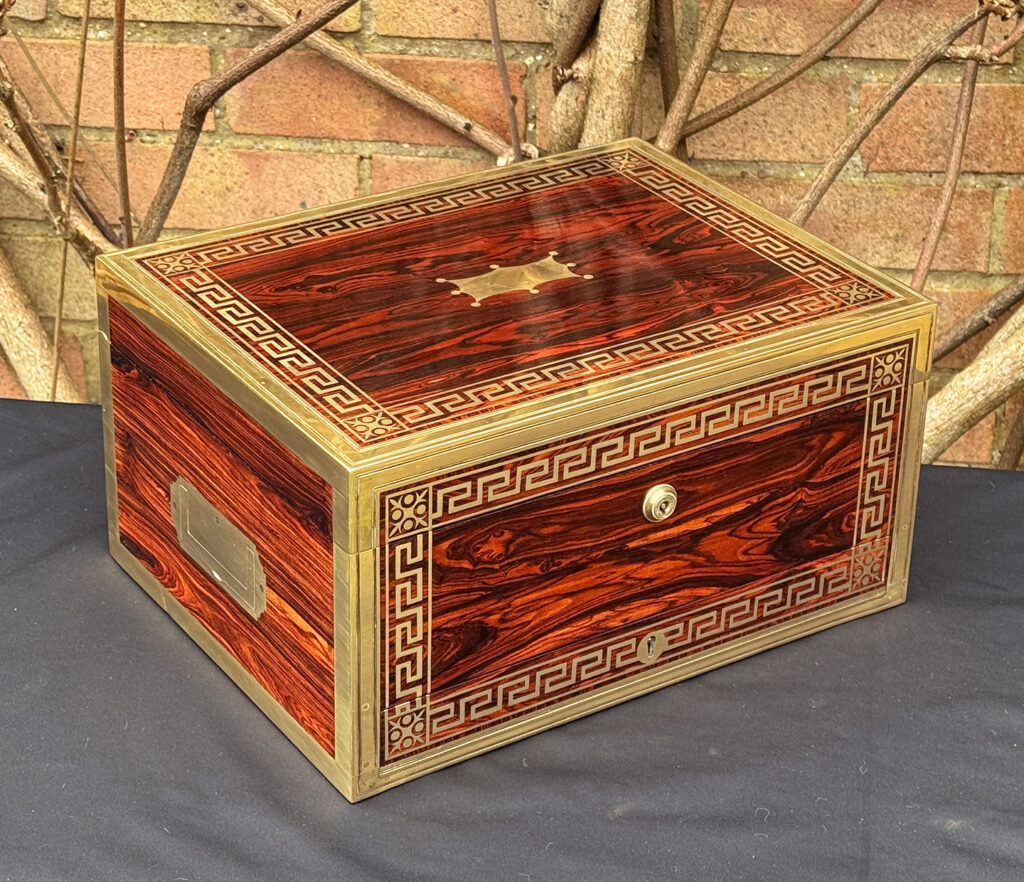 Front left view of an antique jewellery box in kingwood, by Wells & Lambe.