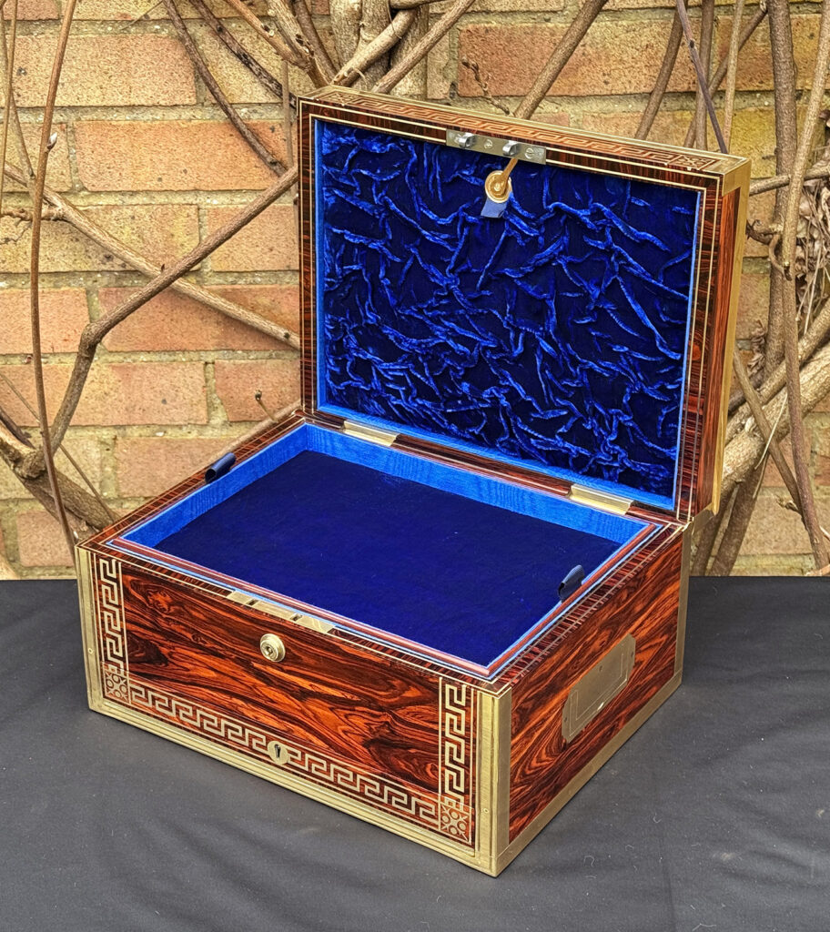 Front right interior view of an antique jewellery box in kingwood, by Wells & Lambe.