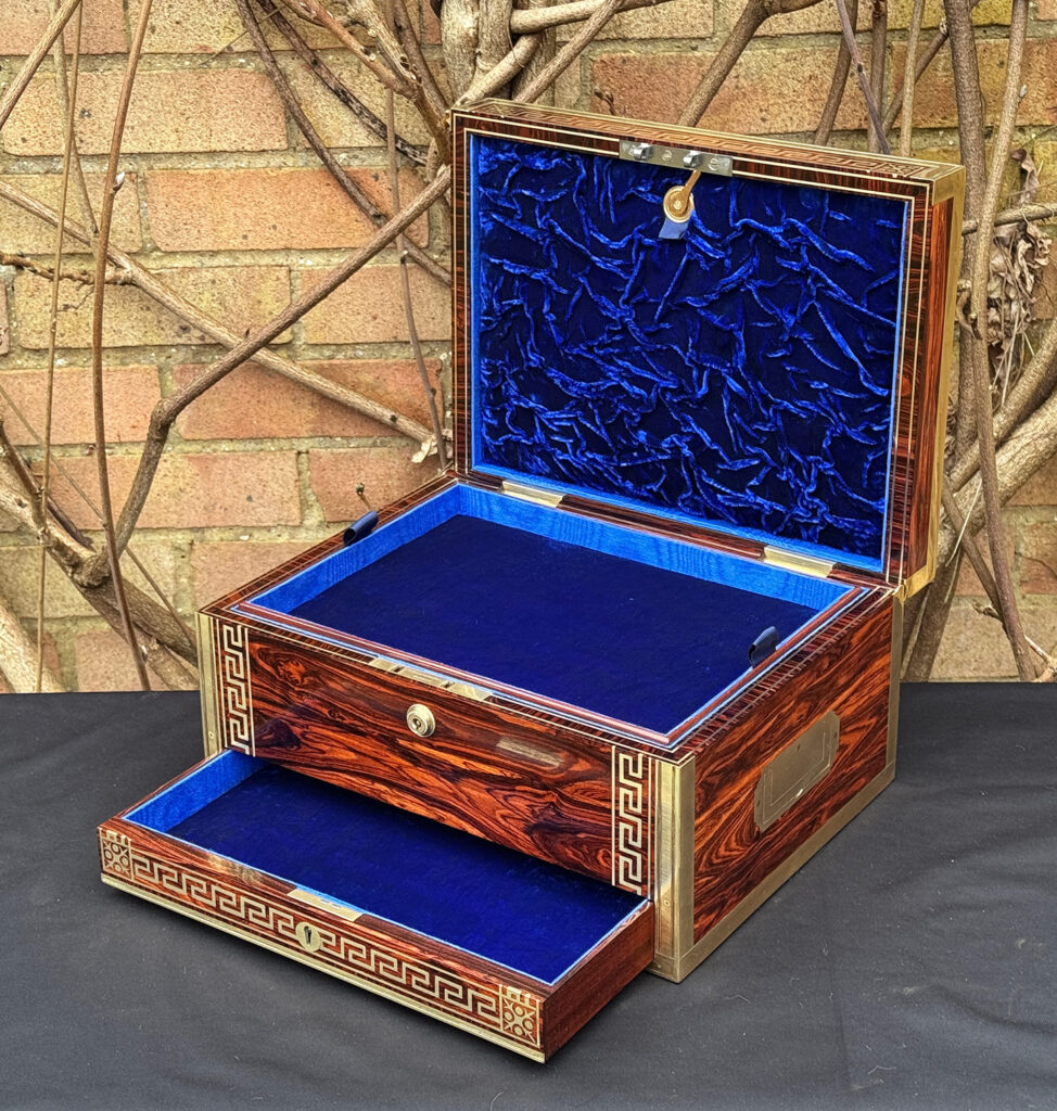 Front right interior view of an antique jewellery box in kingwood, by Wells & Lambe, with lower drawer opened.