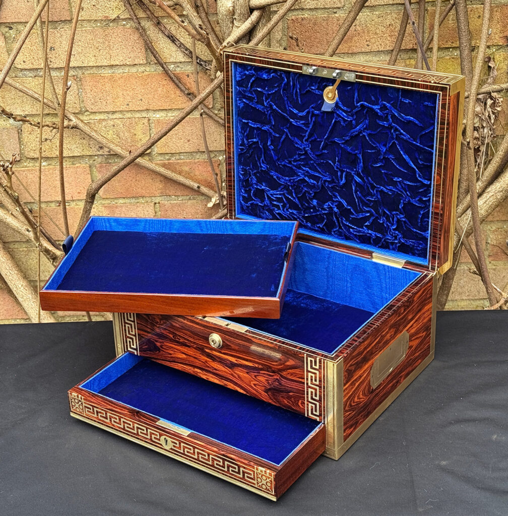 Front right interior view of an antique jewellery box in kingwood, by Wells & Lambe, with tray removed.