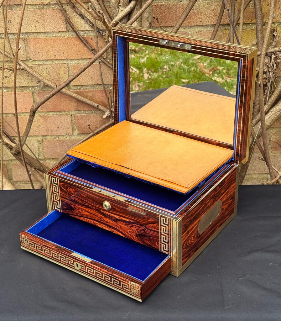 Front right interior view of an antique jewellery box in kingwood, by Wells & Lambe, with concealed letter wallet and mirror on display.