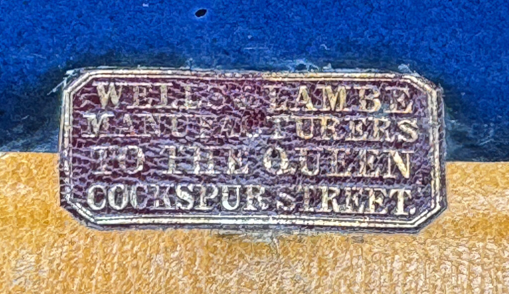 Wells & Lambe gold tooled manufacturer's label.