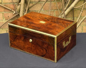 Front right view of an antique jewellery box in rosewood, by Edwards.