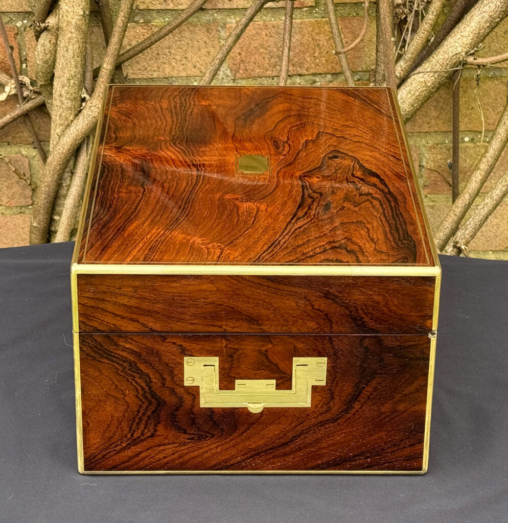 Right side view of an antique jewellery box in rosewood, by Edwards.
