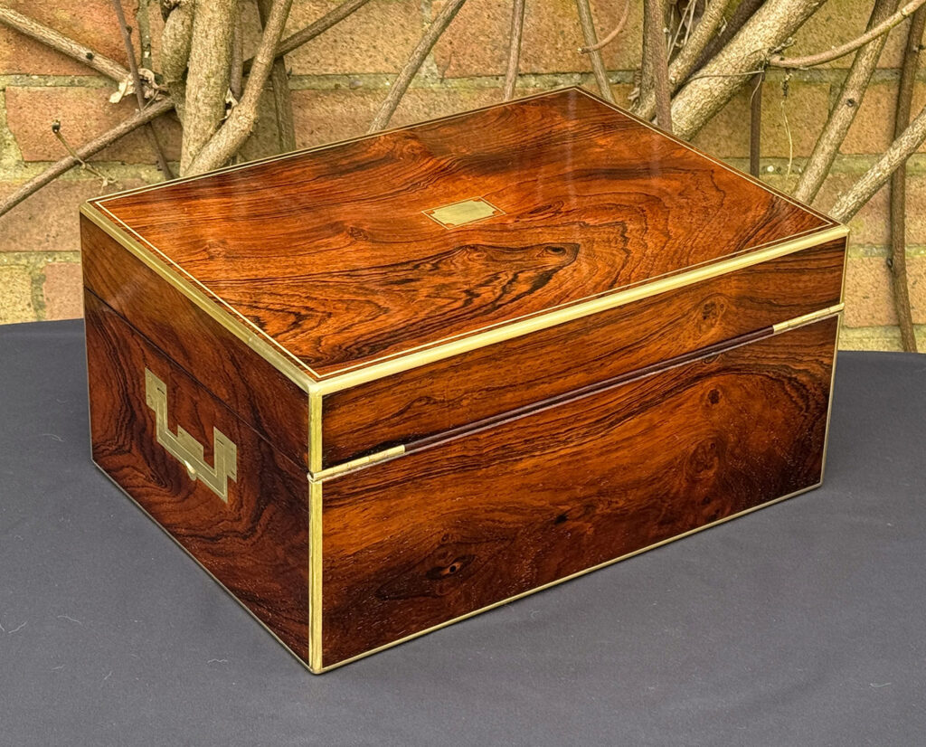 Rear right view of an antique jewellery box in rosewood, by Edwards.