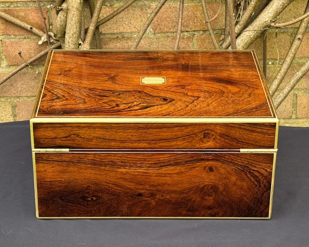 Rear view of an antique jewellery box in rosewood, by Edwards.